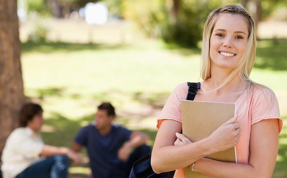 A girl holding a book